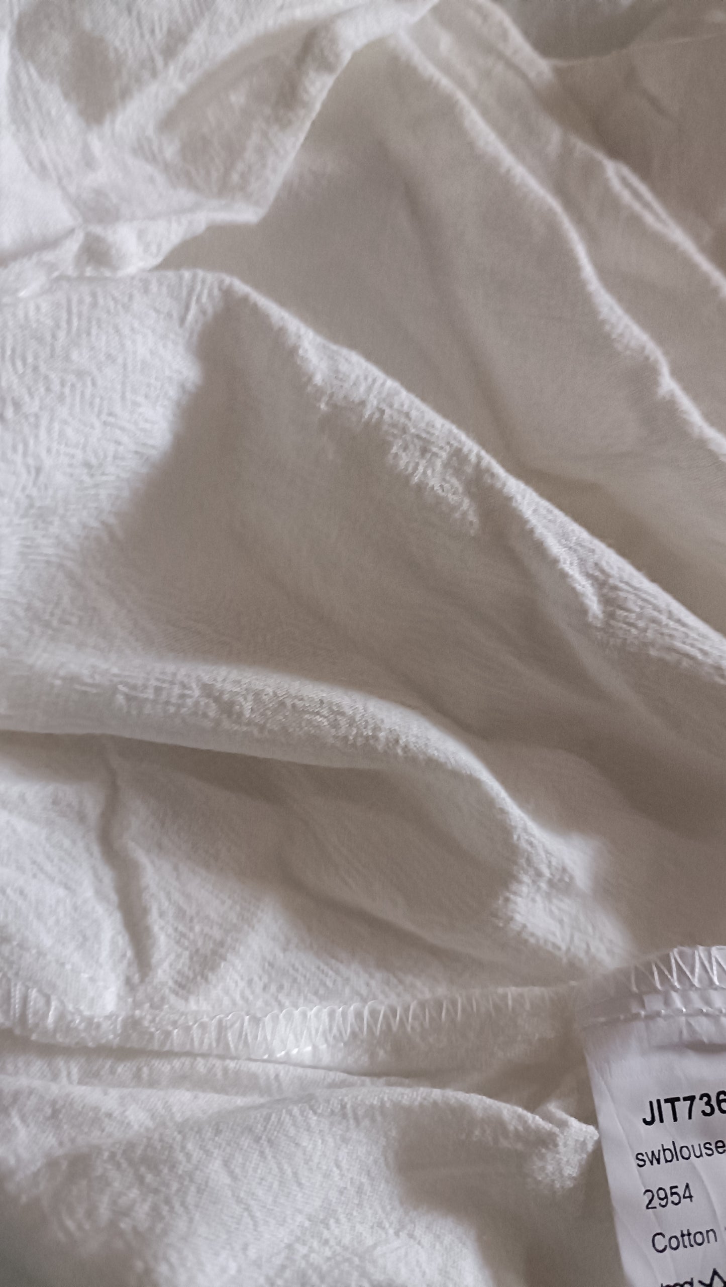 White Shirt with Asymmetric Button Detail