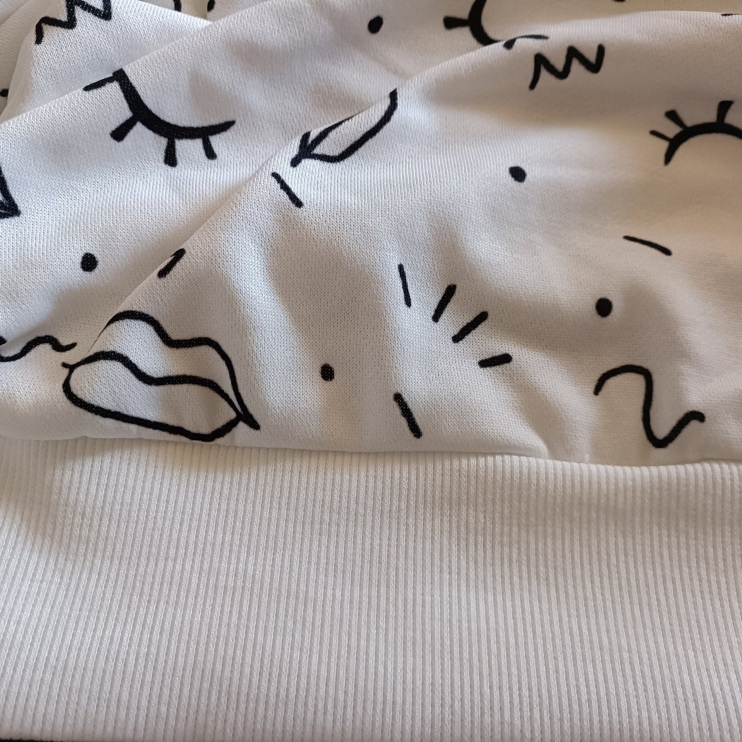 White Sweatshirt with Eyes and Lips Print