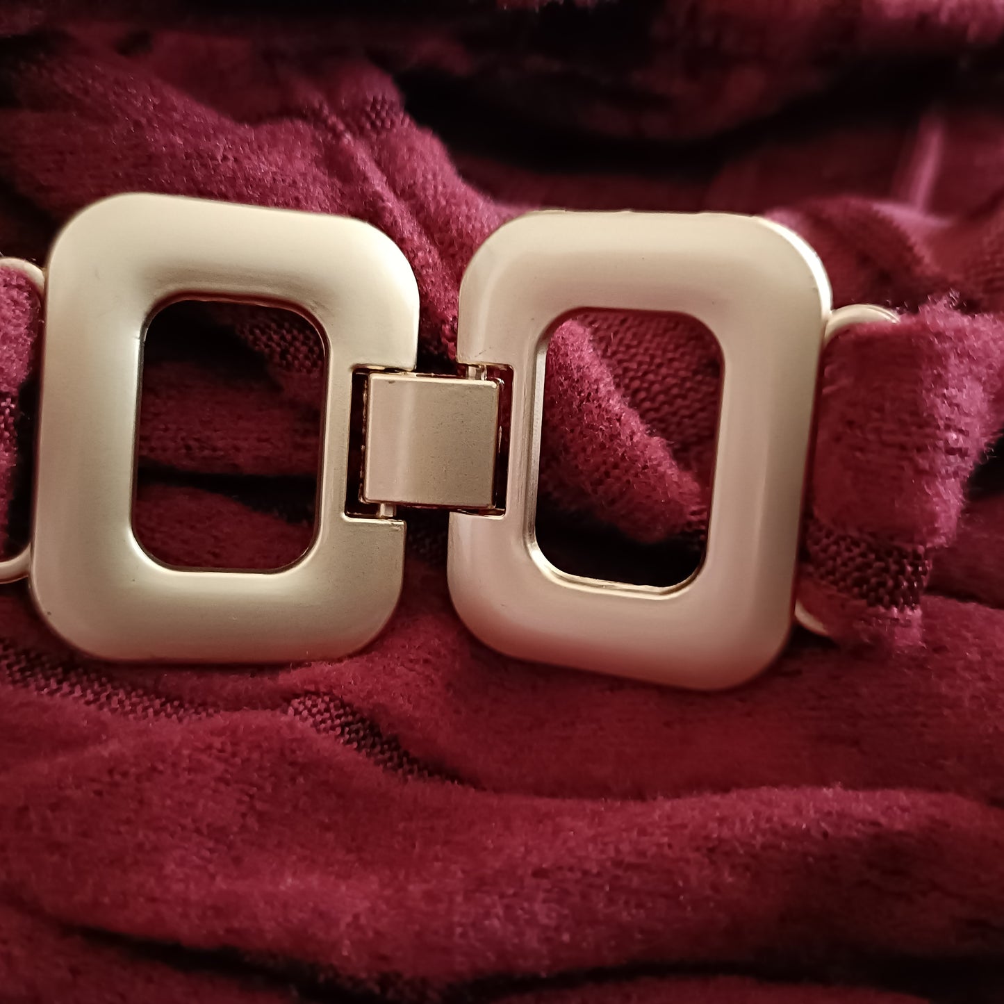 Wine Asymmetrical Top with Strap and Gold Buckle Detail