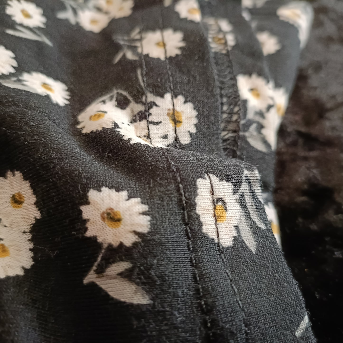 Black Daisy Print Asymmetrical Top with Lace Shoulder Strap and Neckline