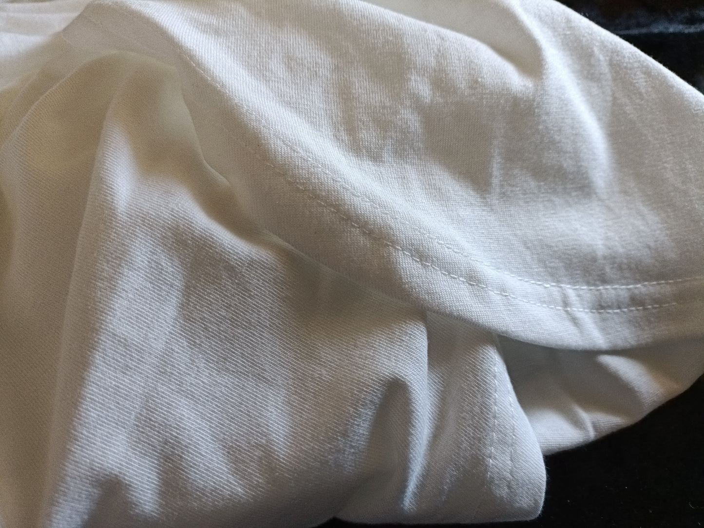 White Top with Gold Lace Trim V Neck and Asymmetric Hemline