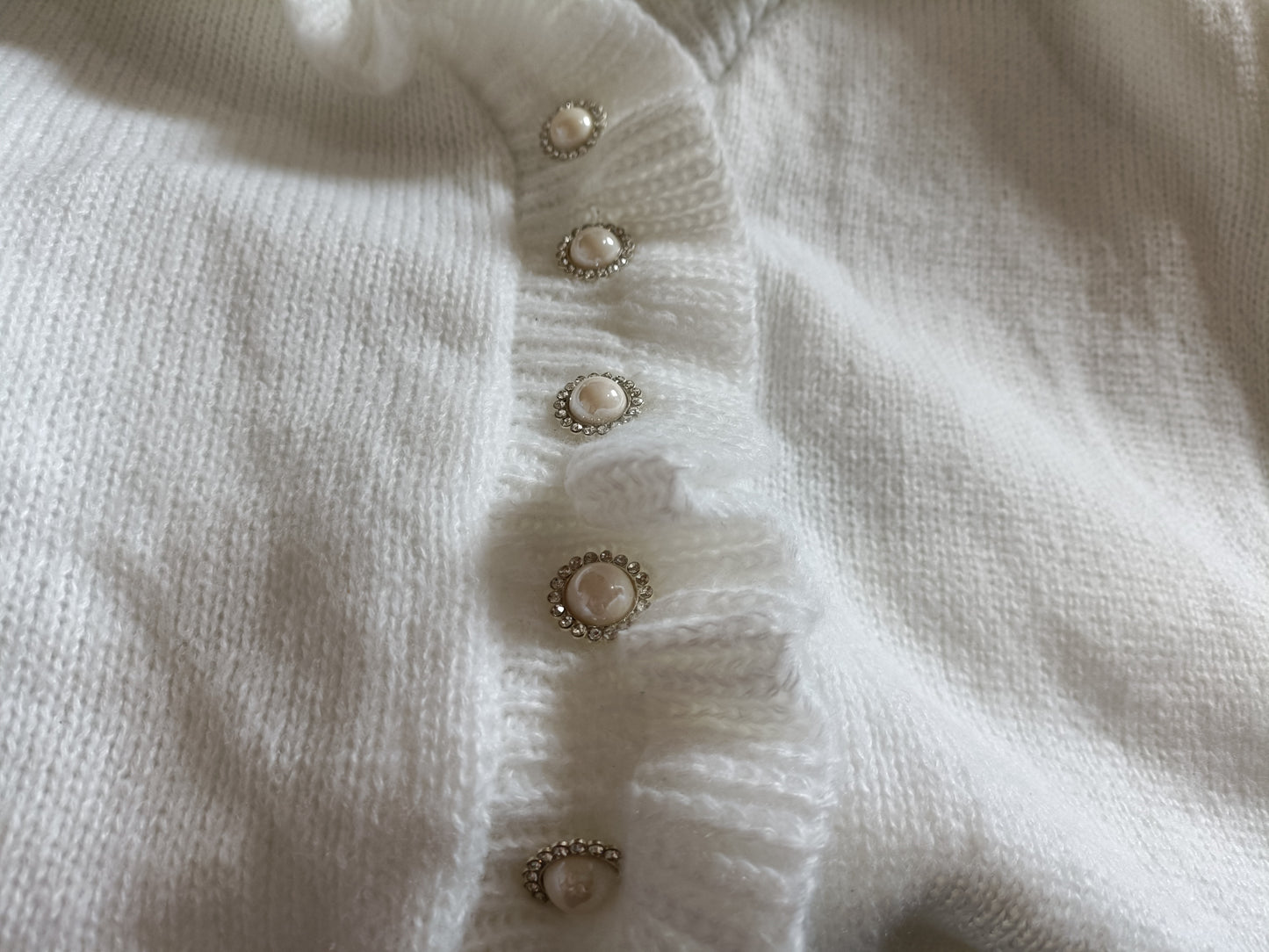 Off White Jumper with Ruffle Neck and Faux Pearl Button Detail