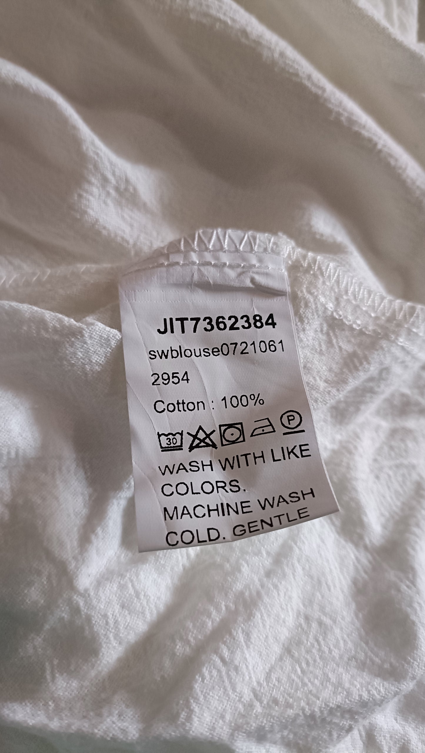 White Shirt with Asymmetric Button Detail