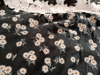 Black Daisy Print Asymmetrical Top with Lace Shoulder Strap and Neckline