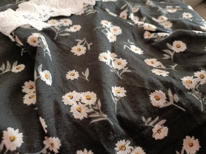 Black Daisy Print Asymmetrical Top with Lace Shoulder Strap and Neckline