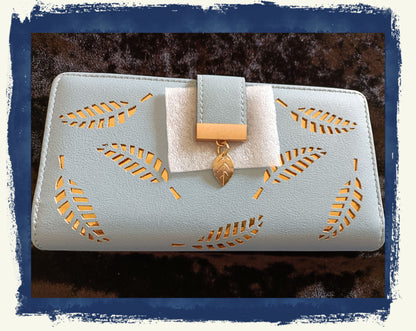 Large Blue Purse with Cut Out Leaf Design
