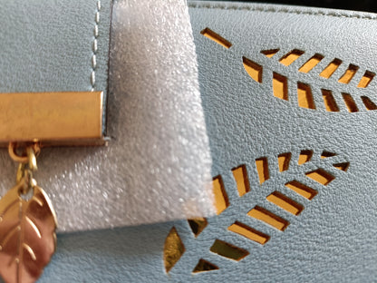 Large Blue Purse with Cut Out Leaf Design