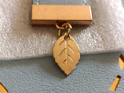 Large Blue Purse with Cut Out Leaf Design